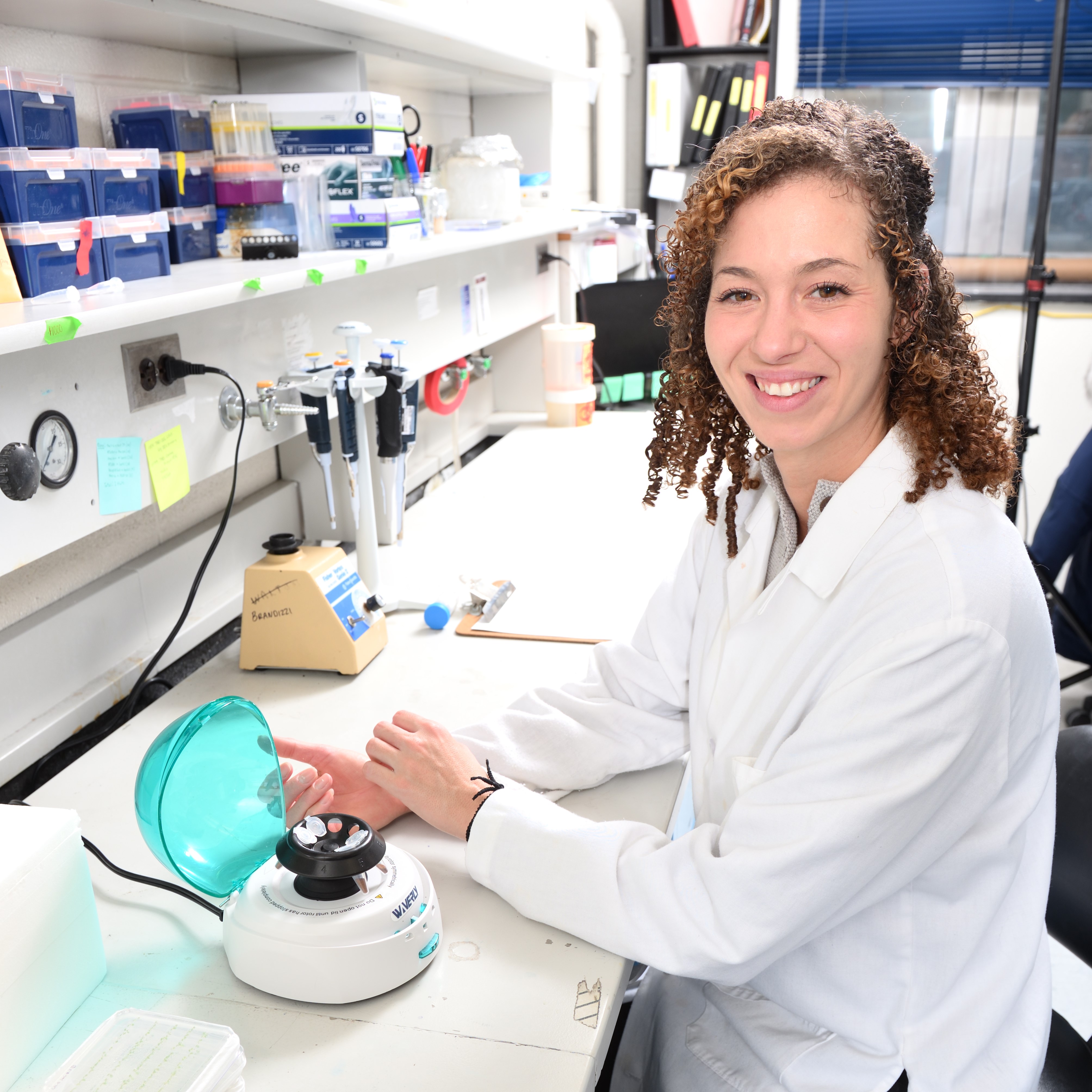 Joanne Thomson sits at a lab bench.